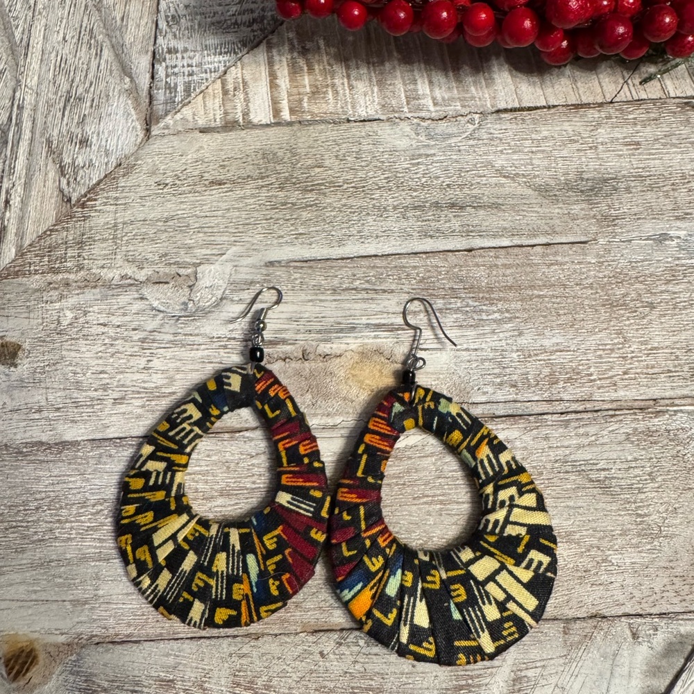 Bought in Kenya, Africa. Colorful geometric pattern wooden earrings